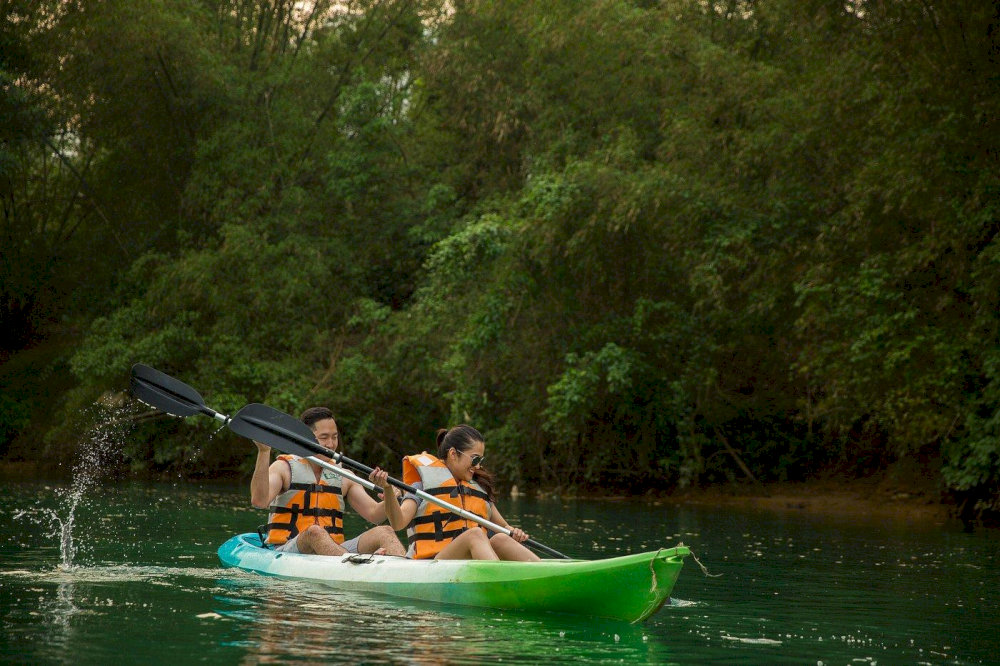 Engage in eco-friendly leisure activities such as paddle boarding or kayaking in a quiet natural space